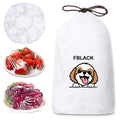 Reusable elastic bowl covers stretched over bowls and plates in kitchen